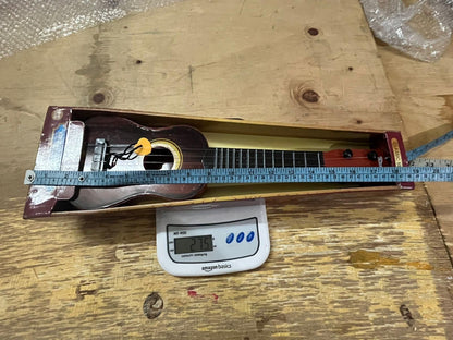 Mini Wooden Finish Plastic Guitar – 4-String Musical Toy for Kids